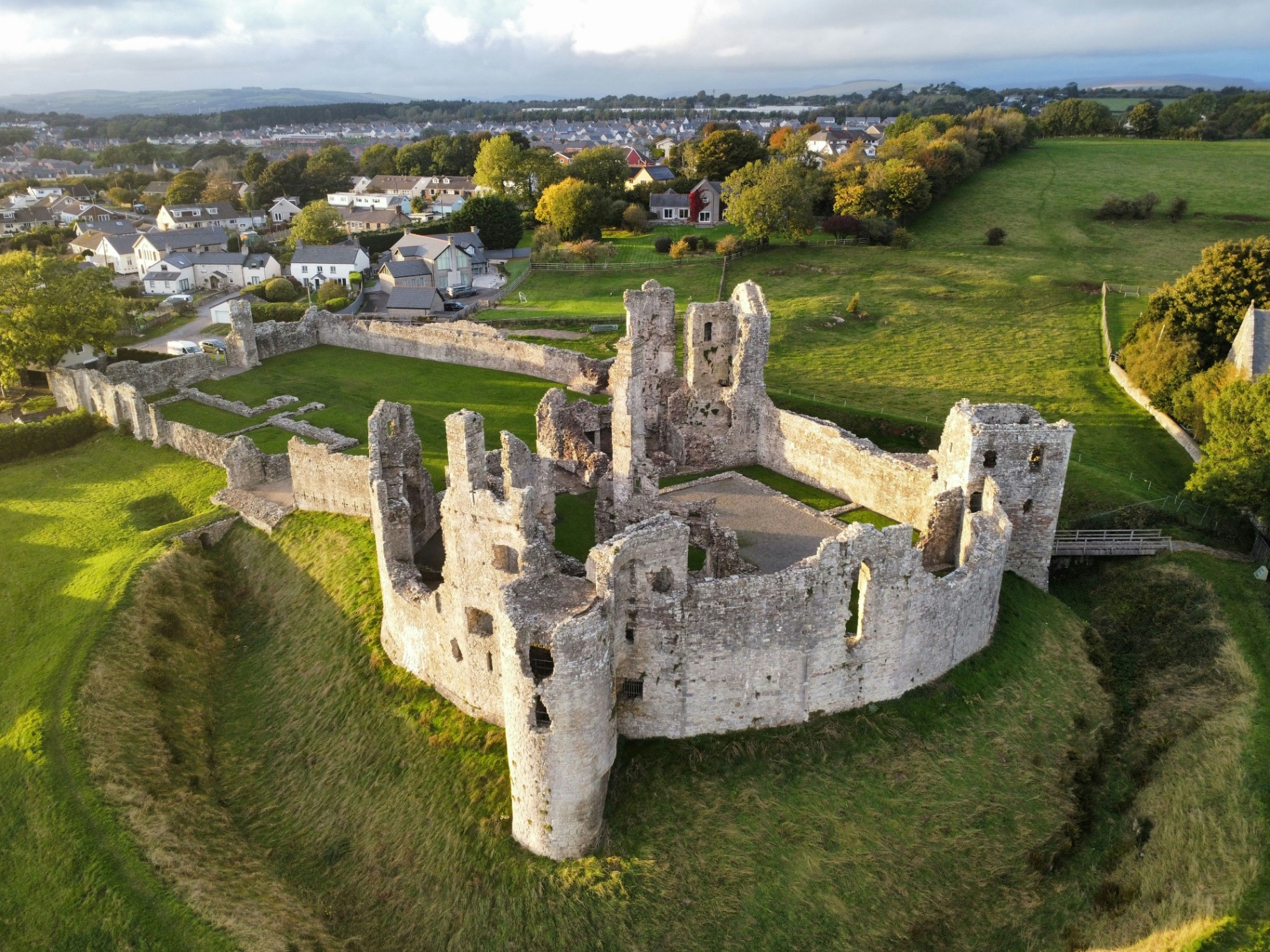 Aerial view of an Irish castle and green landscape